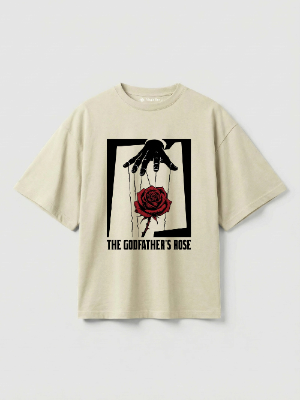 Beige t-shirt with graphic design of a hand holding a rose on a light gray background