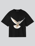 Black t-shirt with a white dove graphic on a light gray background